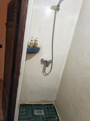 a bathroom with a shower and a sink at Riad Dar Barka Privatisé 3 chambres in Marrakech