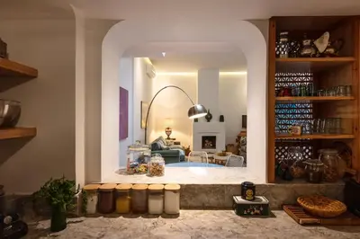 a living room with a large archway in a room at Riad Cosy in Marrakech