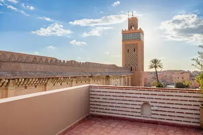 a view of a building with a clock tower at Riad Mimouna - Rooftop view & Breakfast included - 4 Rooms - Fully private in Marrakech