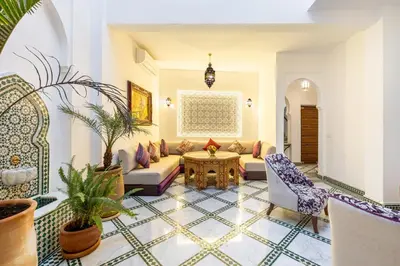 a living room with a couch and chairs and a table at Riad Mimouna - Rooftop view & Breakfast included - 4 Rooms - Fully private in Marrakech