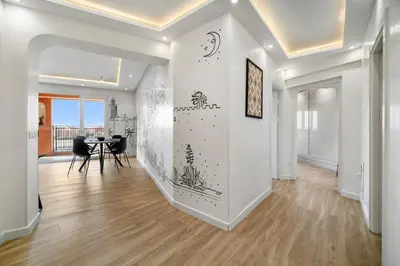 a hallway with a dining room and a dining table at Downtown Cozy Apartment with Panoramic View in Marrakech