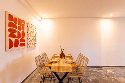 a dining room with a table and chairs at Urban, New 2 BR Apartment in Marrakech
