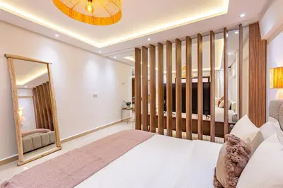 a bedroom with a bed and a large mirror at 10 min from Stadium AFCON Green Table Loft in Marrakech