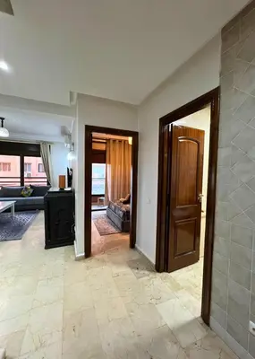 a living room with a door open to a living room at Caprice Palace Residence Bella Anima in Marrakech