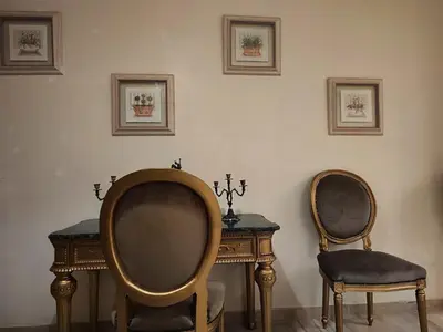 two chairs and a table in a room at Nilia in Marrakech