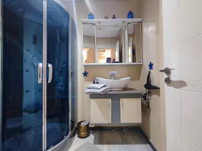 a bathroom with a sink and a shower at Nilia in Marrakech