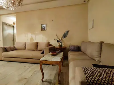 a living room with a couch and a table at Nilia in Marrakech