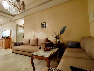 a living room with a couch and a table at Nilia in Marrakech