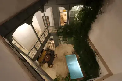 an overhead view of a house with a blue pool at RIAD BAB OUCHKA & Heated pool in Oulad Akkou
