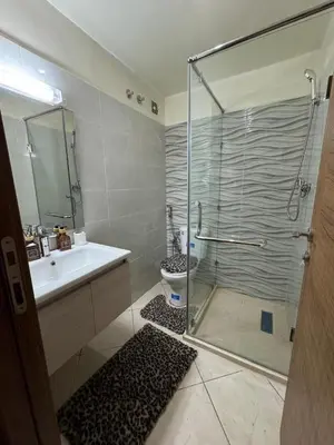 a bathroom with a shower and a sink and a toilet at Marrakech mahamid location vacances 3 chember in Marrakech