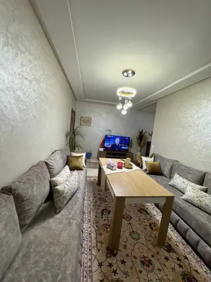 a living room with a couch and a table at Marrakech mahamid location vacances 3 chember in Marrakech
