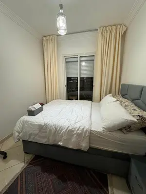 a bedroom with a bed and a window at Marrakech mahamid location vacances 3 chember in Marrakech