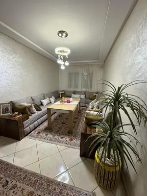 a living room with a couch and a table at Marrakech mahamid location vacances 3 chember in Marrakech