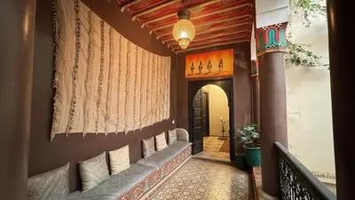 a hallway of a home with a wall with curtains at Riad Lana Marrakech - Dar el Bacha Luxury Suites in Marrakech