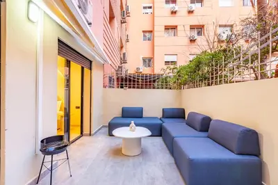 a patio with a couch and a table on a building at Le Nid de Guéliz Private terrace and silence in Marrakech