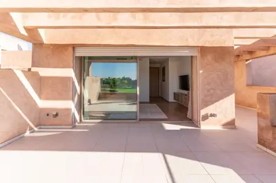 an open glass door of a building with a view of a patio at Private Pool Villa Facing Golf Luxury inMarrakech in Marrakech