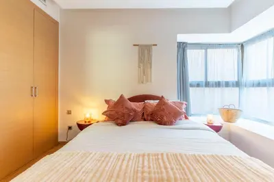 a bedroom with a large bed with a window at Private Pool Villa Facing Golf Luxury inMarrakech in Marrakech