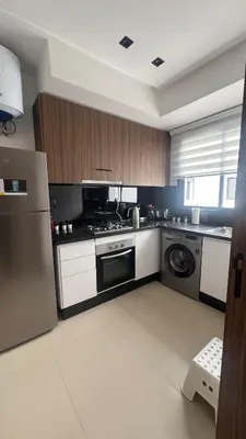 a kitchen with a stove and a dishwasher at Cozy apartment Kenza Menara Garden 2 - 2 rooms in Marrakech