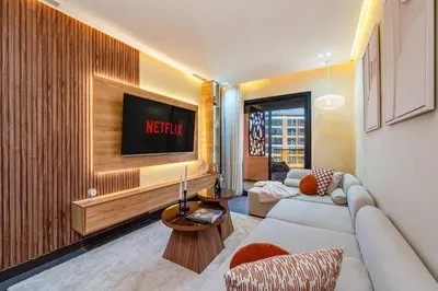 a living room with a couch and a tv at Gueliz Signature Terrasse and Comfort in Marrakech