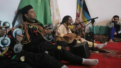 a group of people sitting in a living room playing instruments at Proworkshop in Marrakech