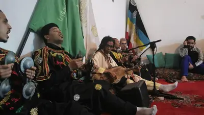 a group of men in traditional clothing playing music at Proworkshop in Marrakech