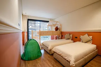 a bedroom with two beds and a green tent at Spacious duplex Private HEATED pool Jacuzzi in Marrakech
