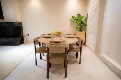 a dining room with a table and chairs at Spacious duplex Private HEATED pool Jacuzzi in Marrakech