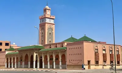 a building with a clock tower on top of it at Nice apart wi-fi 3rd floor in El Gouassem