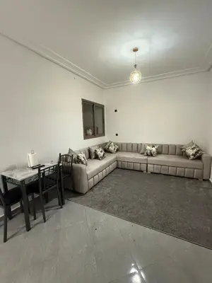 a living room with a couch and a table at Marrakech appartement in Marrakech