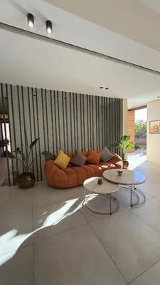 a living room with a couch and a table at Luxury villa Noria golf club in Marrakech