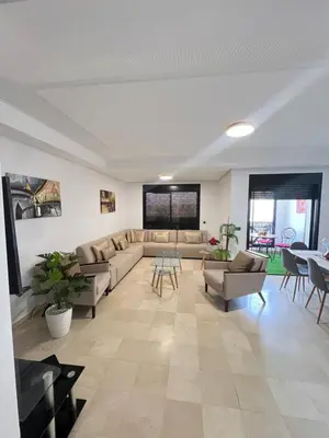 a large living room with couches and a table at Quite place for your vacation in Marrakech