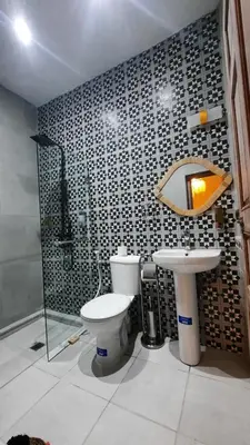 a bathroom with a toilet and a sink at Hotel & Riad Celia in Marrakech