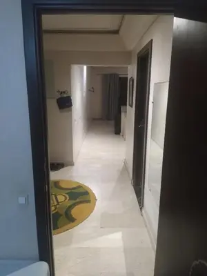 an empty hallway with a rug on the floor at chambre Economic Gueliz in Marrakech
