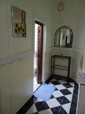 a room with a black and white checkered floor at Appartement Chez Anita in Marrakech