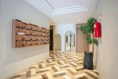 a hallway with a room with wine bottles on the wall at Inside A Mood - Marrakech in Marrakech