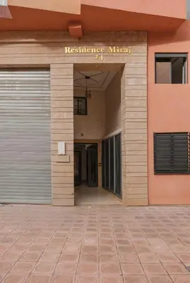 a garage door in front of a building at Appartement chic et confortable au cœur de Gueliz in Marrakech