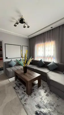 a living room with a couch and a coffee table at Beautiful suite Apartment in the heart of Marrakech in Marrakech