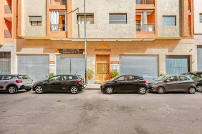 a group of cars parked in front of a building at NEW Guéliz I Blue Mirage I Crafts and modernity in Marrakech