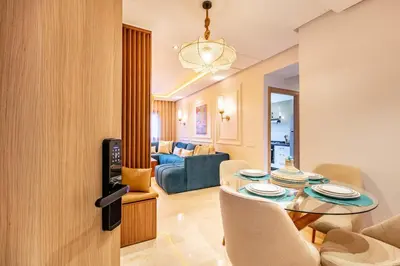 a living room with a table and a couch at NEW Guéliz I Blue Mirage I Crafts and modernity in Marrakech