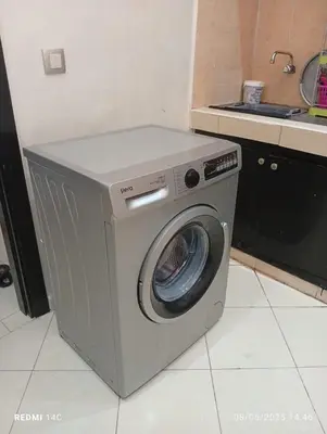 a washing machine in a kitchen with a sink at Appartement Marrakchi in Marrakech