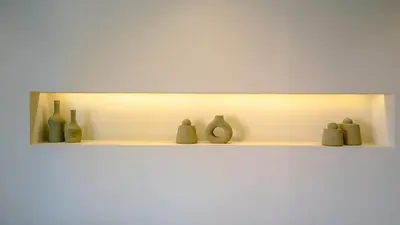 a row of vases sitting on a shelf at Suites 25, Hivernage, Calme, 2BR, Marrakech in Marrakech