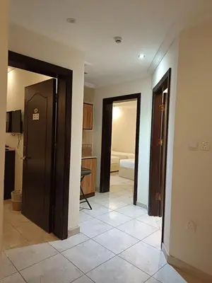a hallway with two doors and a room with a bedroom at شقة مروان in Marrakech