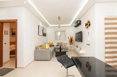 a living room with a couch and a table at Red City Elegant Stay in Marrakech