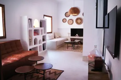 a living room with a couch and two tables at Dar Helen in Marrakech