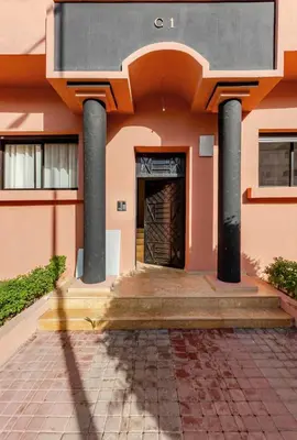 a building with columns and a door in front at Premium Holliday Marrakesh in Marrakech