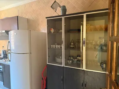 a kitchen with a white refrigerator at اقامة كنزي مراكش كليز in Marrakech