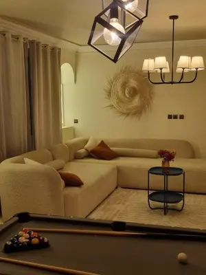 a living room with a couch and a pool table at La Boheme City Center Entire Unique Appart 3Bdr 3Bthr in Marrakech