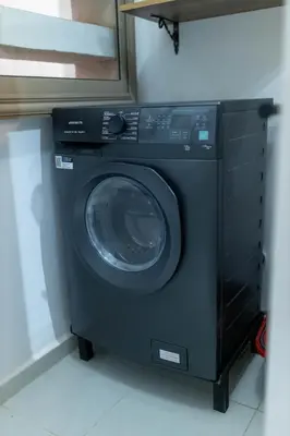 a washing machine in a room with a mirror at Casaterra Luxury apartment with pool & home-cinema in Marrakech