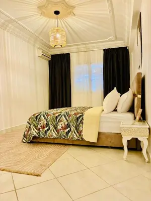 a bedroom with a bed and a window at the sweet night of Marrakech in Marrakech