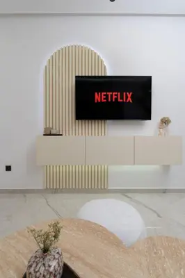 a netflix sign on a wall in a room at Dar élégant au centre de Marrakech piscine in Marrakech
